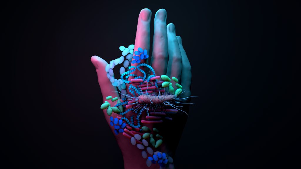 Conceptual illustration of antimicrobial resistance showing bacteria and microbes on a human hand. Highlights the risks of untreatable infections discussed in The International Risk Podcast episode with Dr. Ramanan Laxminarayan.