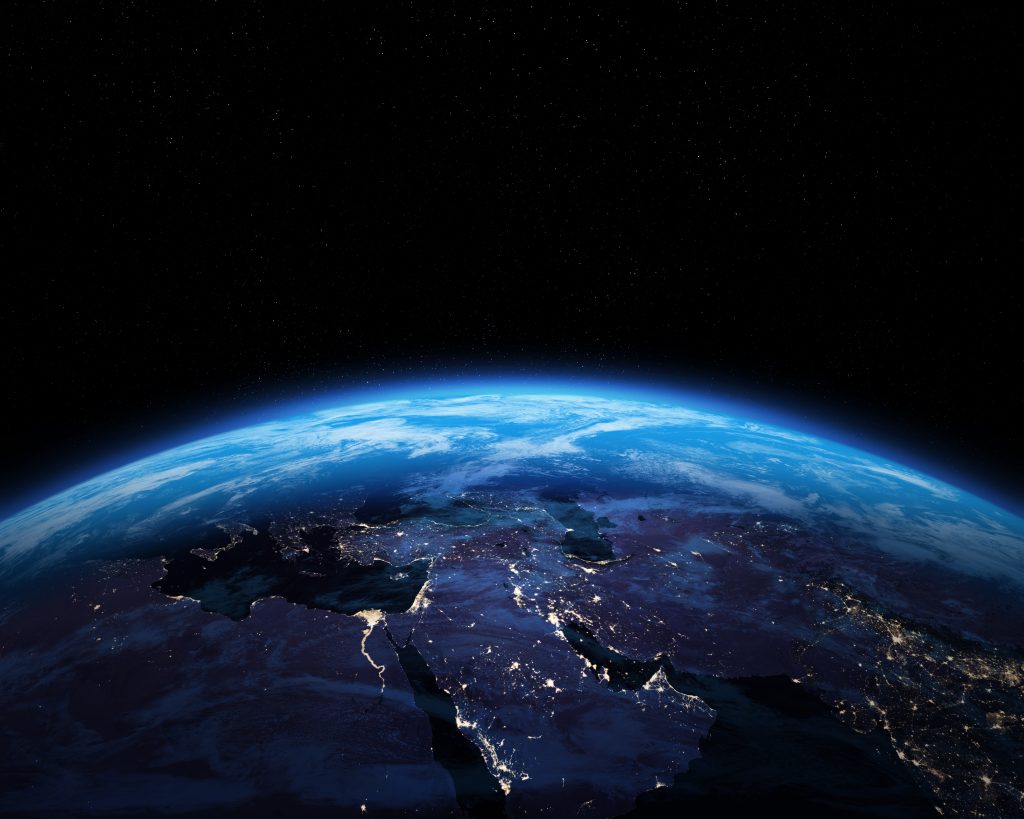 Satellite view of the Middle East at night, highlighting Iraq, Syria, and Lebanon amid shifting U.S. strategies.