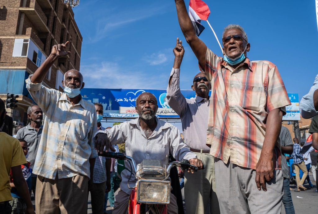 Sudanese civilians protesting political instability and governance crisis during ongoing civil war