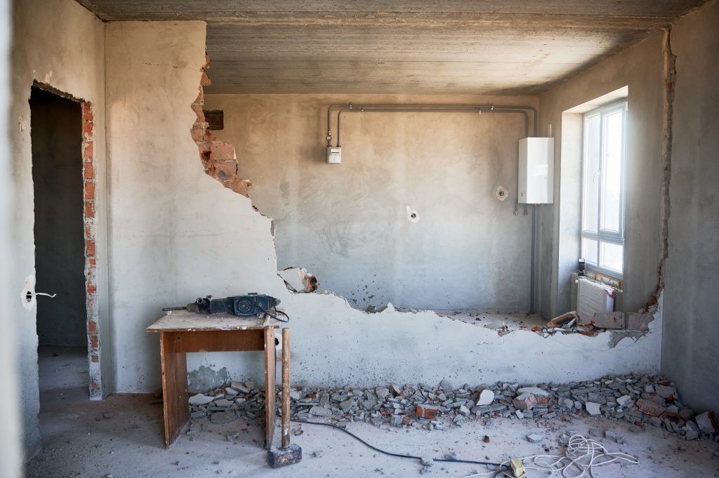 Destroyed apartment interior showing infrastructure damage and urban devastation from ongoing conflict