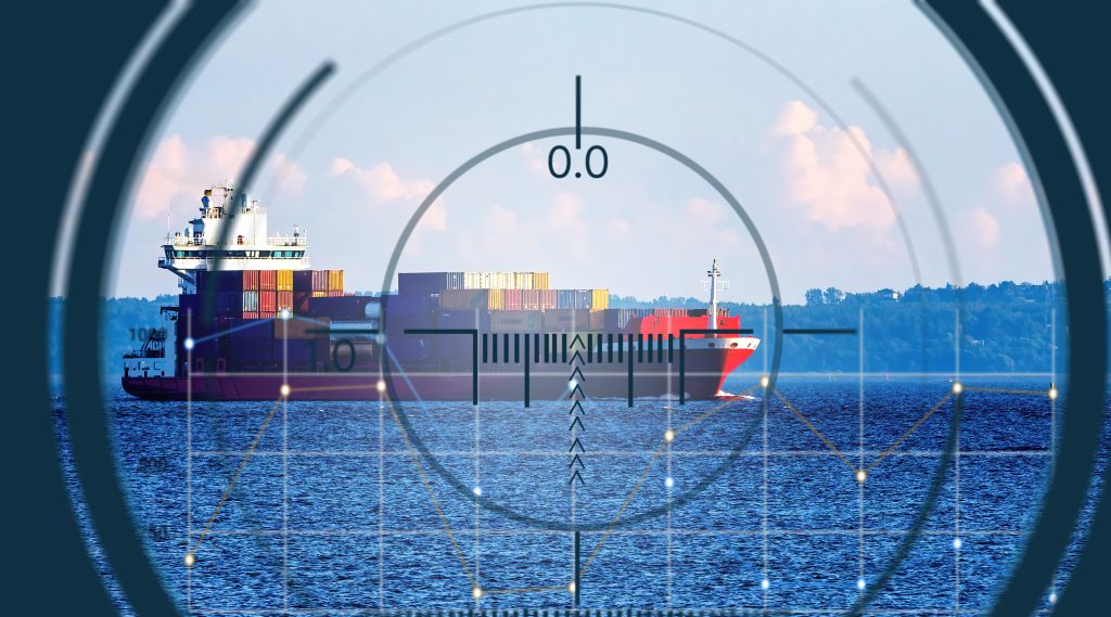Cargo ship in maritime chokepoint under surveillance highlighting global trade vulnerability and maritime security risks
